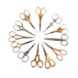 Twelve pairs of 20th Century scissors, all with decorative arms or loops including a pair with