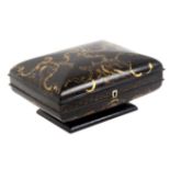 An unusual format and particularly well fitted papier mâché sewing box, circa 1830, the box of