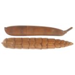 Two carved wooden needle cases, comprising a pea pod, 10cms, and a pine cone, 10cms.    (2)