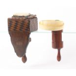 Two sewing clamps, comprising a walnut cylinder form example with pin cushion top and mounted with