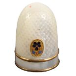 A Palais Royal thimble, with double gilt band and oval gilt metal and enamel pansy motif, cracks