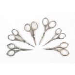 Six pairs of late 19th Century and early 20th Century silver handled continental scissors, all