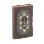 A rare skein book, the leather boards inset with panels of geometric and floral beadwork, hinged