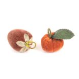 Two fruit form emeries, comprising a velvet strawberry with linen leaves below a bound loop, 5.5cms,