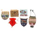 Six small 19th and 20th Century beadwork bags and purses, including two floral decorated draw string