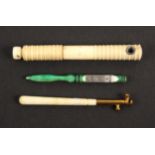 Three 19th Century needle threaders, comprising a green stained ivory example the metal plate