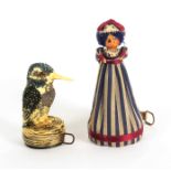 Two novelty tape measures, comprising a celluloid example in the form of a kingfisher on a nest,