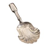 A silver caddy spoon, the shell form bowl with bright cut border and fiddle pattern handle,