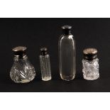 Four 19th Century silver top scent bottles, comprising a cut glass example with engraved silver