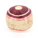 An 18th Century 'spiders web' silk pin ball, one side in cream, purple and pink the other cream