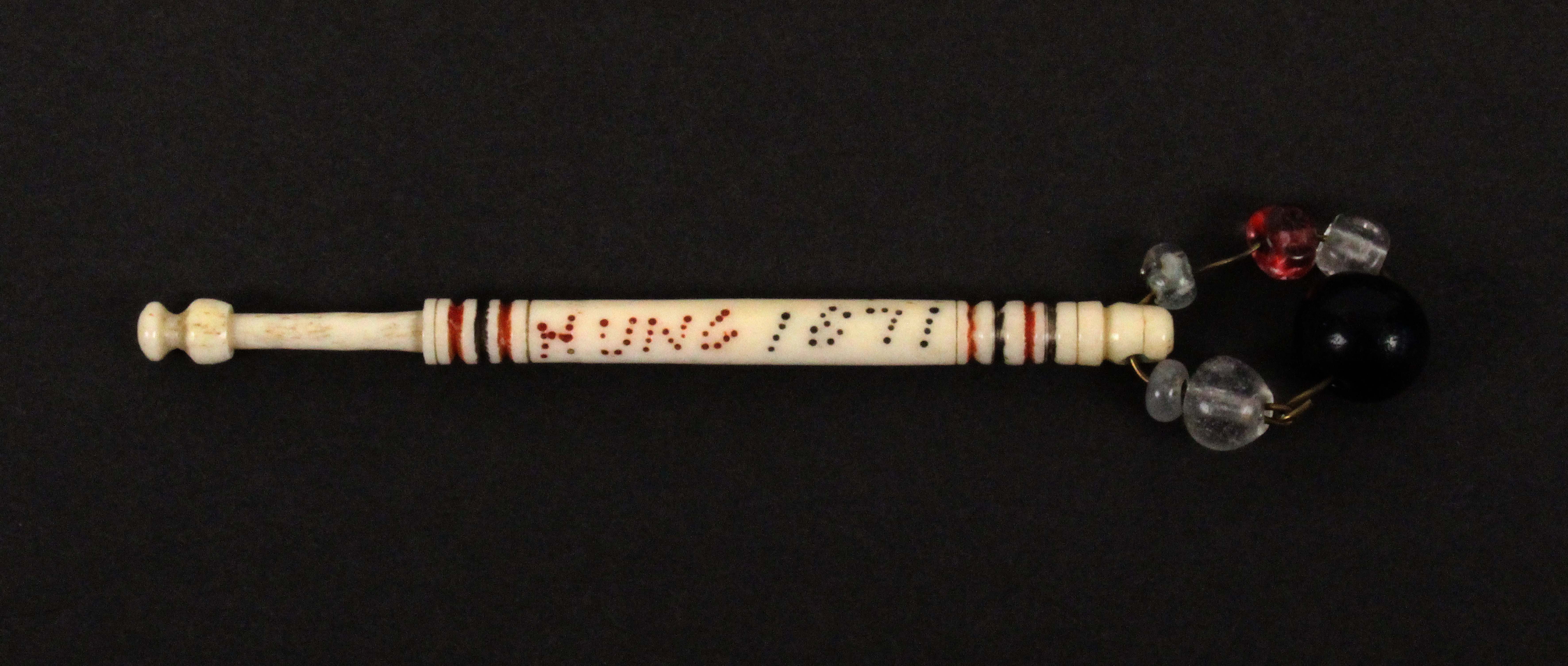 A scarce bone hanging bobbin, spot inscribed in red and black 'W. Bull Hung 1871', attributed to the - Image 2 of 2