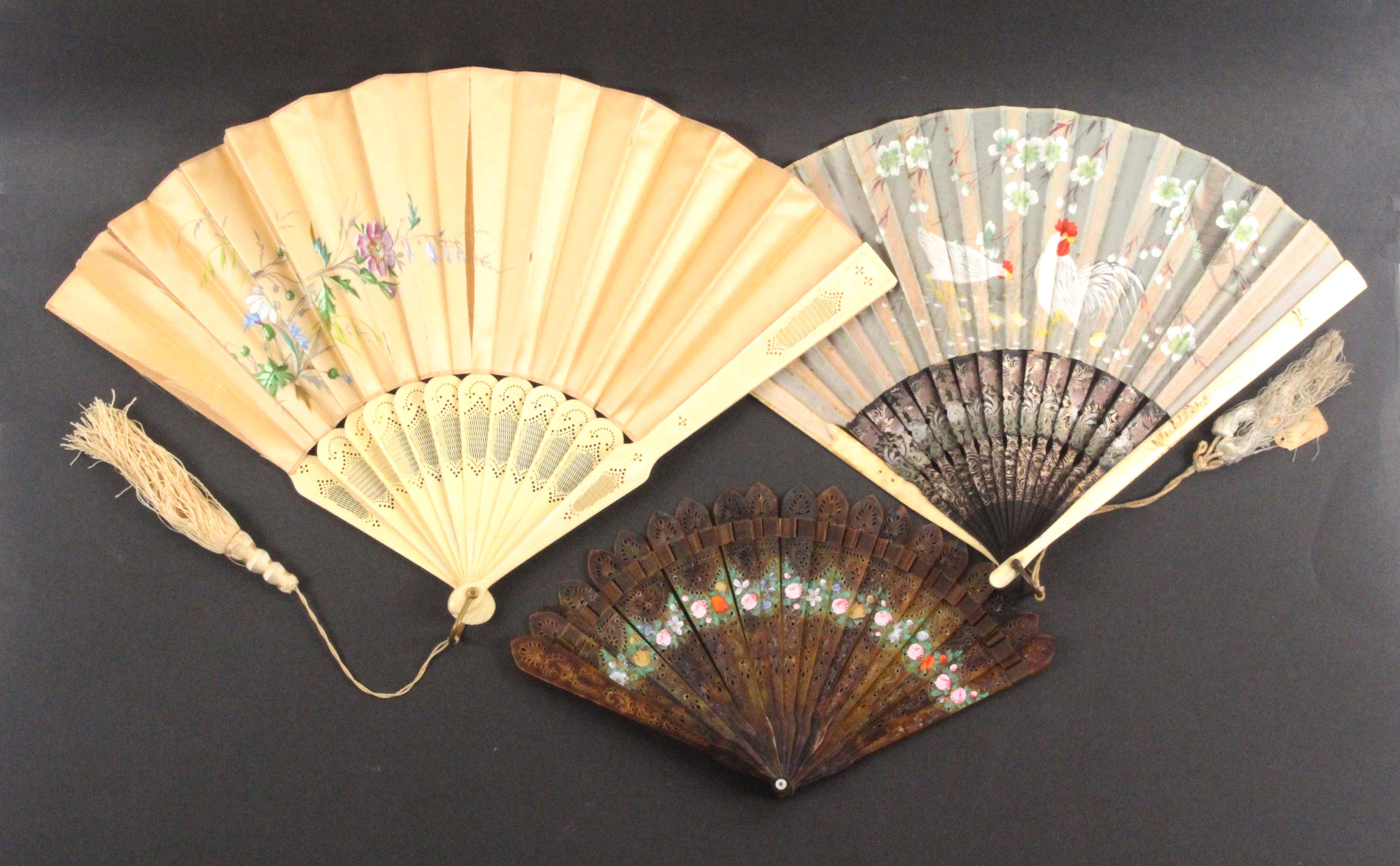 Three fans, comprising a 19th Century pierced tortoiseshell example painted with a band of