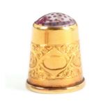 A Norwegian gold thimble, with a broad band incorporating a vacant oval and four oval floral