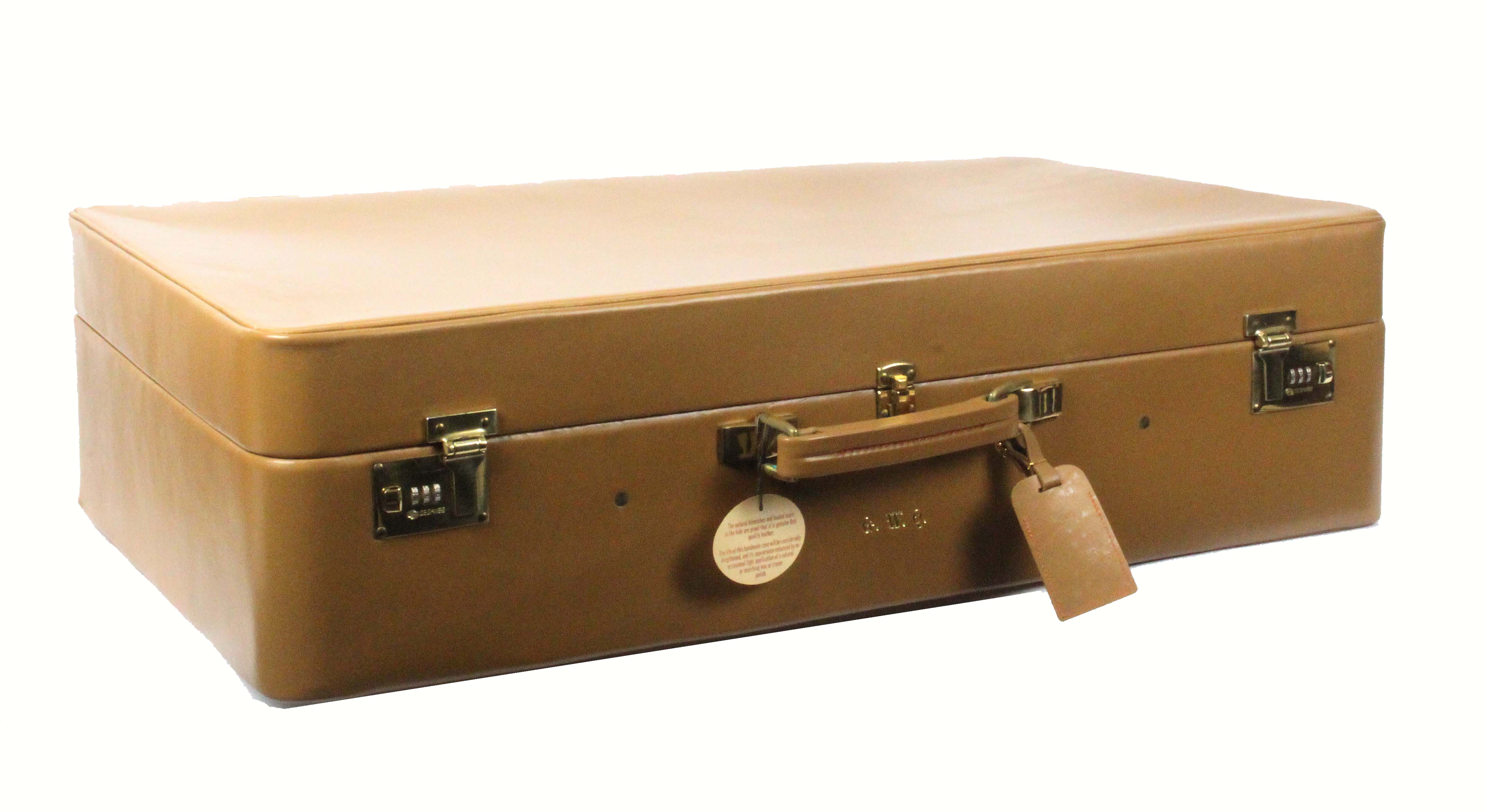 Asprey - London, a light tan leather suitcase, unused, rectangular, brass Sesamee combination