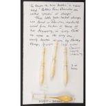 A card display of four lace bobbins, Downton bob-tailed dumps comprising three bone examples,