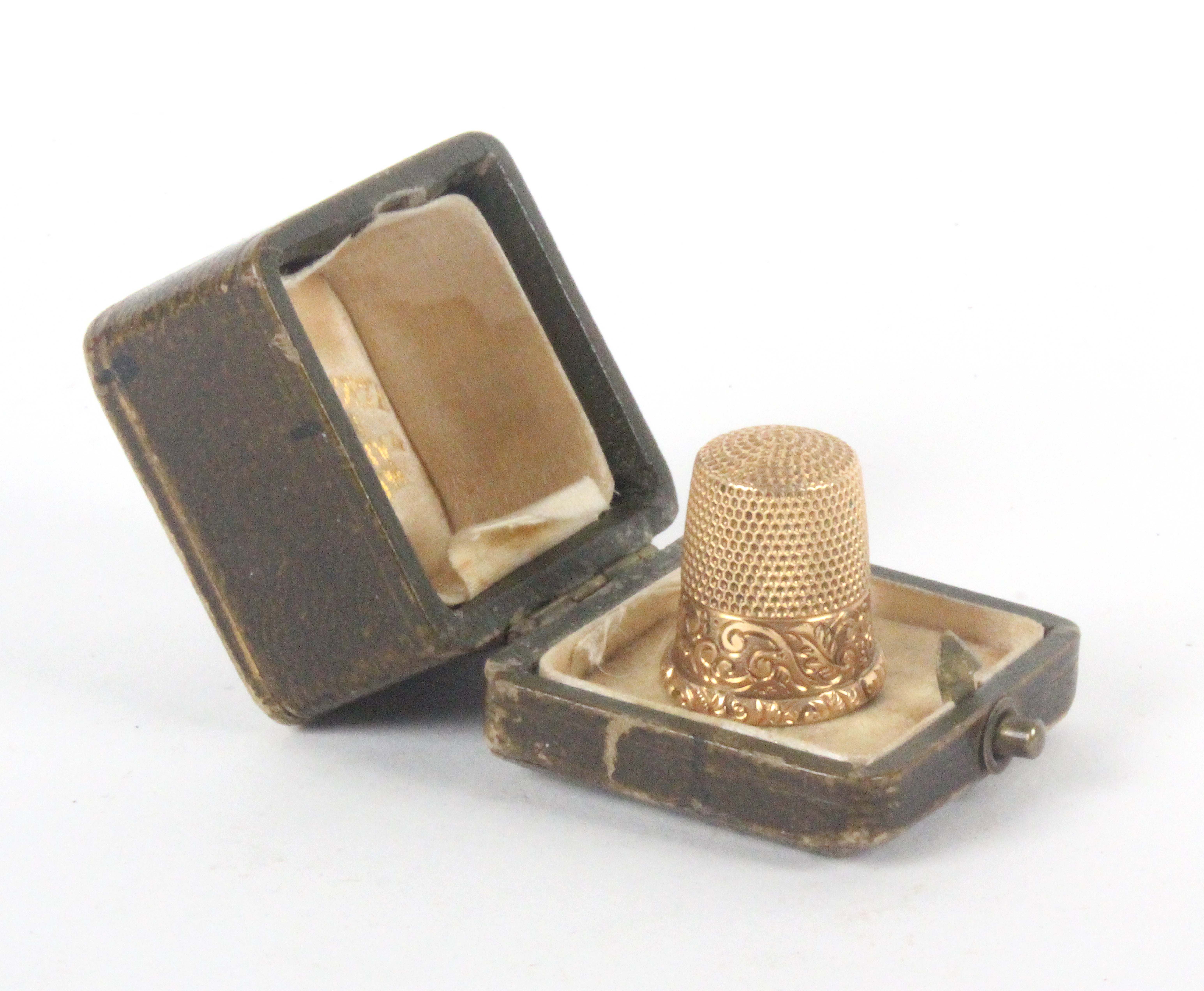 An American 14k gold thimble, by Ketcham and McDougall the scroll decorated frieze with vacant - Image 2 of 2