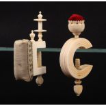 Two 19th Century ivory sewing clamps, comprising a rib turned 'C' frame example below a vase form