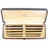 A fine cased set of five gold and coral mounted tortoiseshell crochet hooks, of graduated size,