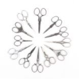 Twelve pairs of late 19th Century/early 20th Century steel scissors, including a novices pair,
