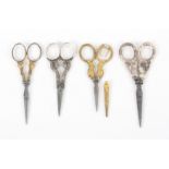 Four pairs of 19th Century scissors, comprising a French pair with engraved gilt arms, 10cms, and