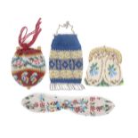 Four small 19th Century beadwork purses, comprising a misers example, 20cms, a floral draw string