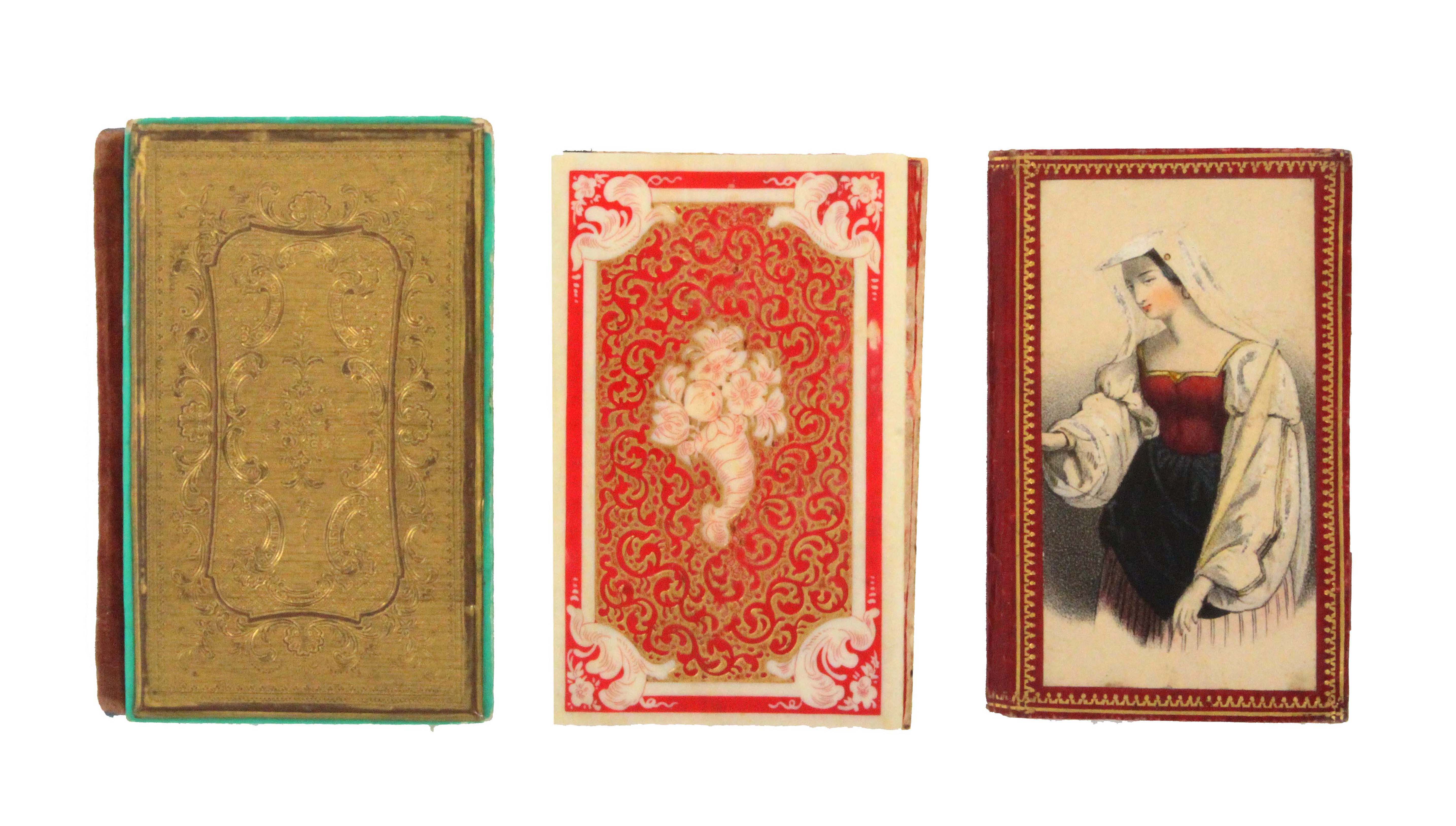 Three needle books, comprising a fine 19th Century ivory example the cover part stained in red and