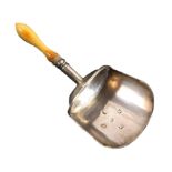 A silver caddy spoon, the plain shovel bowl on a cylinder handle terminating in a bone baluster