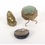 Three metal pin cushions, comprising a brass example in the form of a tripod table, 4cms, a brass