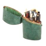 A late 18th Century green shagreen etui, the case of oval section and slightly tapering, hinged