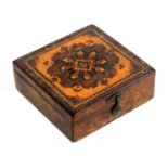 A Tunbridge ware rosewood cased compass, of square form the hinged lid with a panel of geometric