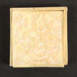 An early 19th Century Chinese carved ivory Tangram box and puzzle, the lid to the box carved with