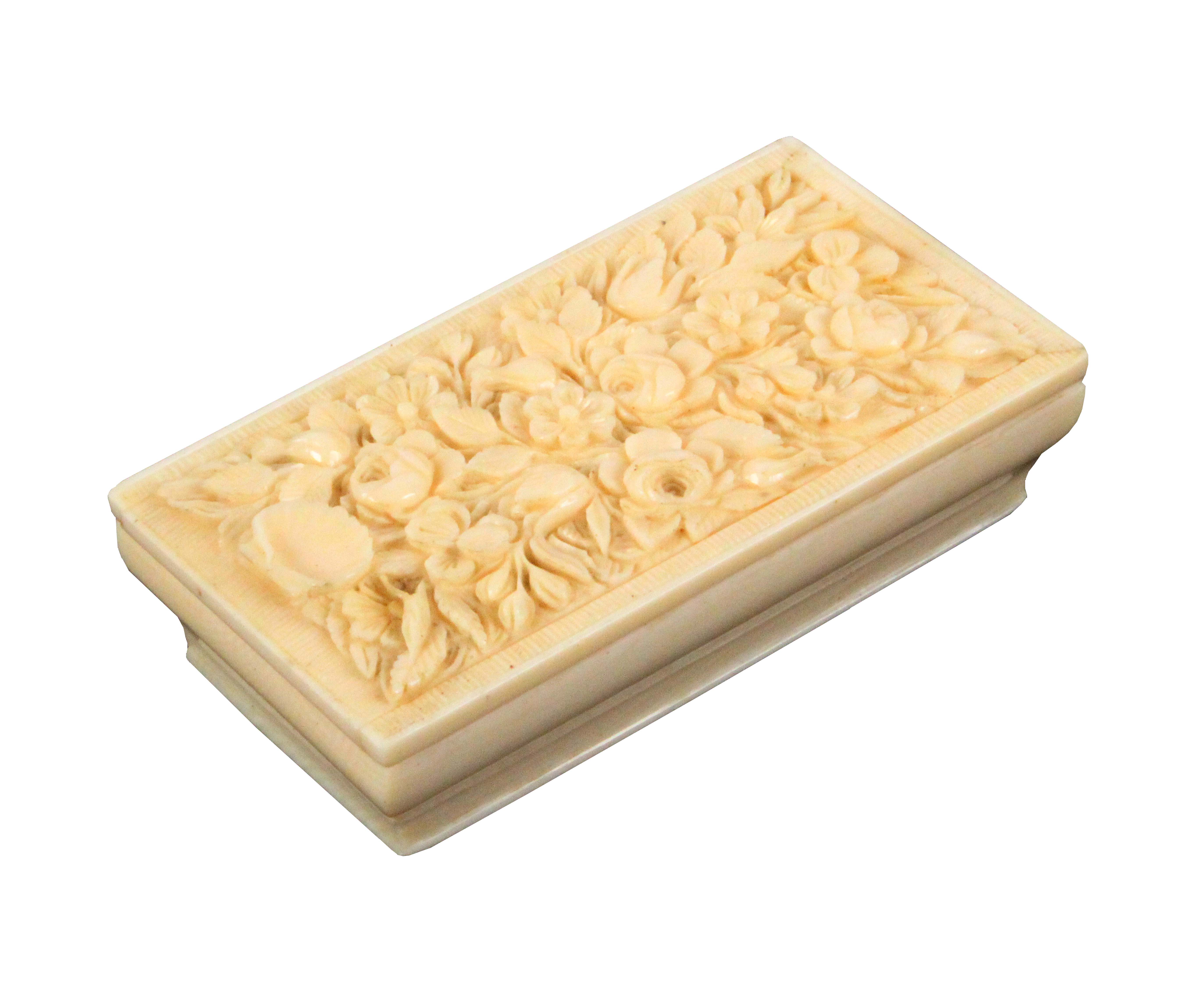 A fine 19th Century French carved ivory needle case, of rectangular form the ogee moulded sides