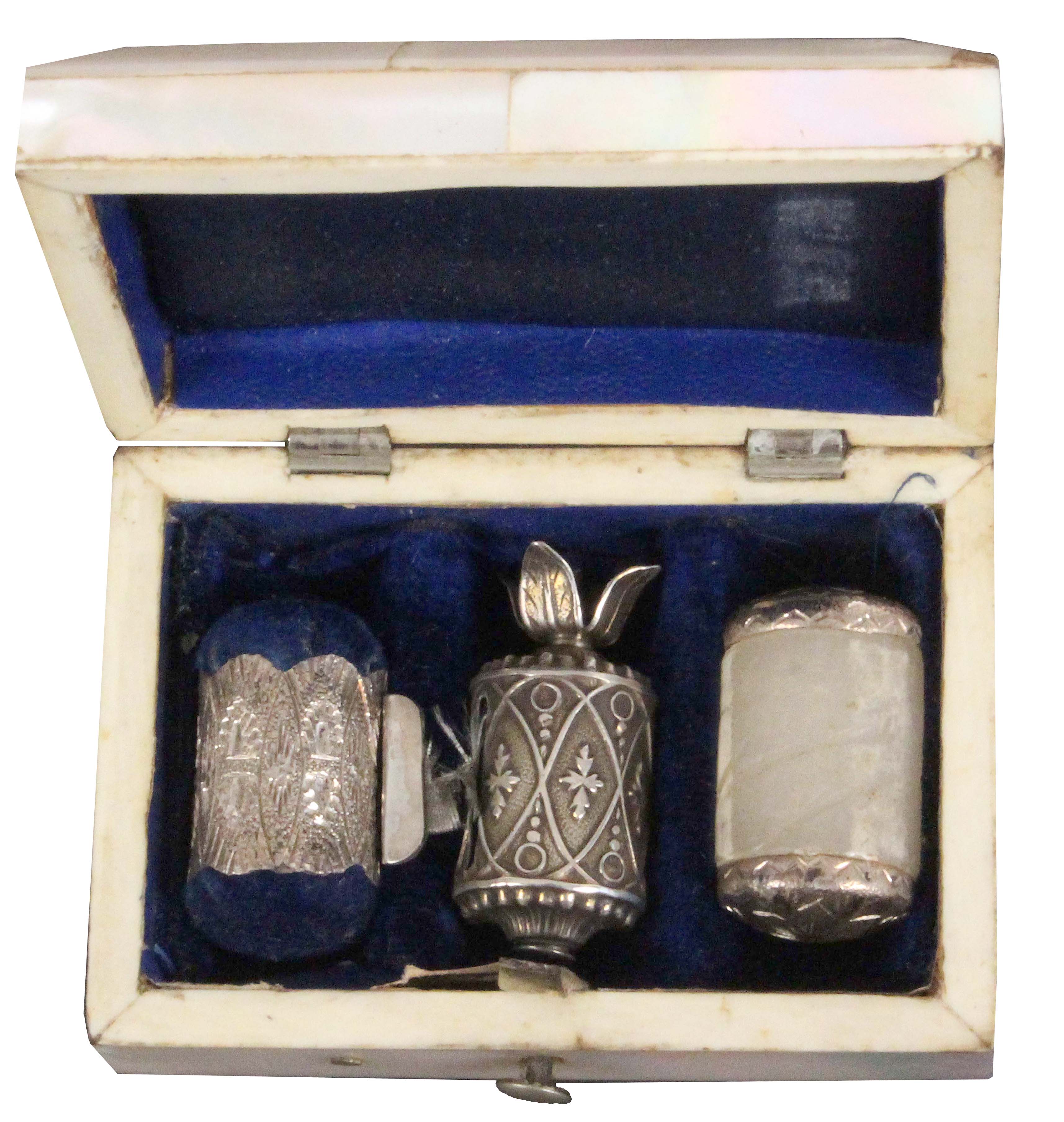 A three piece silver sewing set, circa 1840, contained in a rectangular mother of pearl case, the