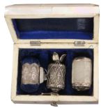 A three piece silver sewing set, circa 1840, contained in a rectangular mother of pearl case, the