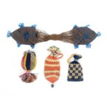 Four small or miniature 19th Century purses, comprising a beaded example of saddle bag form,