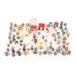 A collection of mostly modern souvenir thimbles, in various materials.    (90+)