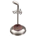 A silver hat pin stand and pin cushion, in the form of a golf club with 'umbrella' stand fitting