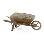 A brass Avery needle packet case, 'Wheel Barrow', hinged floral rose cover, four spoke wheel,