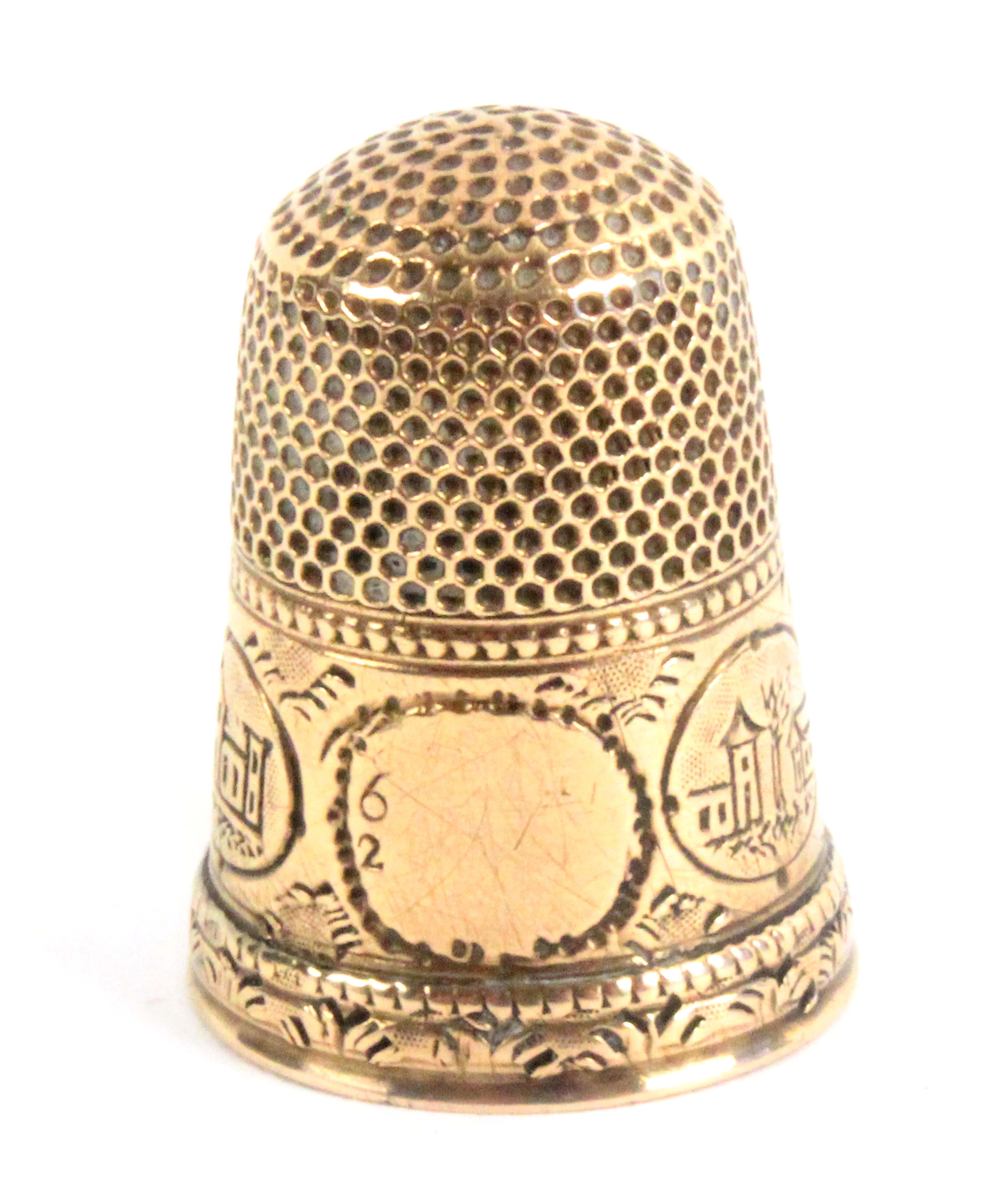 A gold thimble, probably American, the frieze with a vacant cartouche but numbered 6 over 2 and four