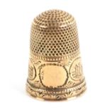 A gold thimble, probably American, the frieze with a vacant cartouche but numbered 6 over 2 and four