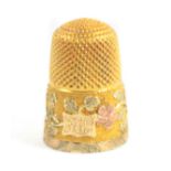 A Victorian three colour gold thimble, the frosted frieze with a cartouche initialled 'AW' and