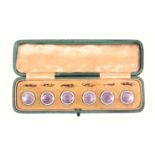 A set of six silver and enamel dress buttons, in green leather rectangular case, each in pink floral