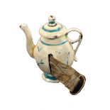 A scarce novelty metal tape measure in the form of a coffee pot, painted in blue on an ivory ground,