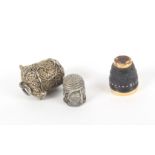 An 18th Century silver filigree thimble in case and a coquilla thimble, the first of small size with