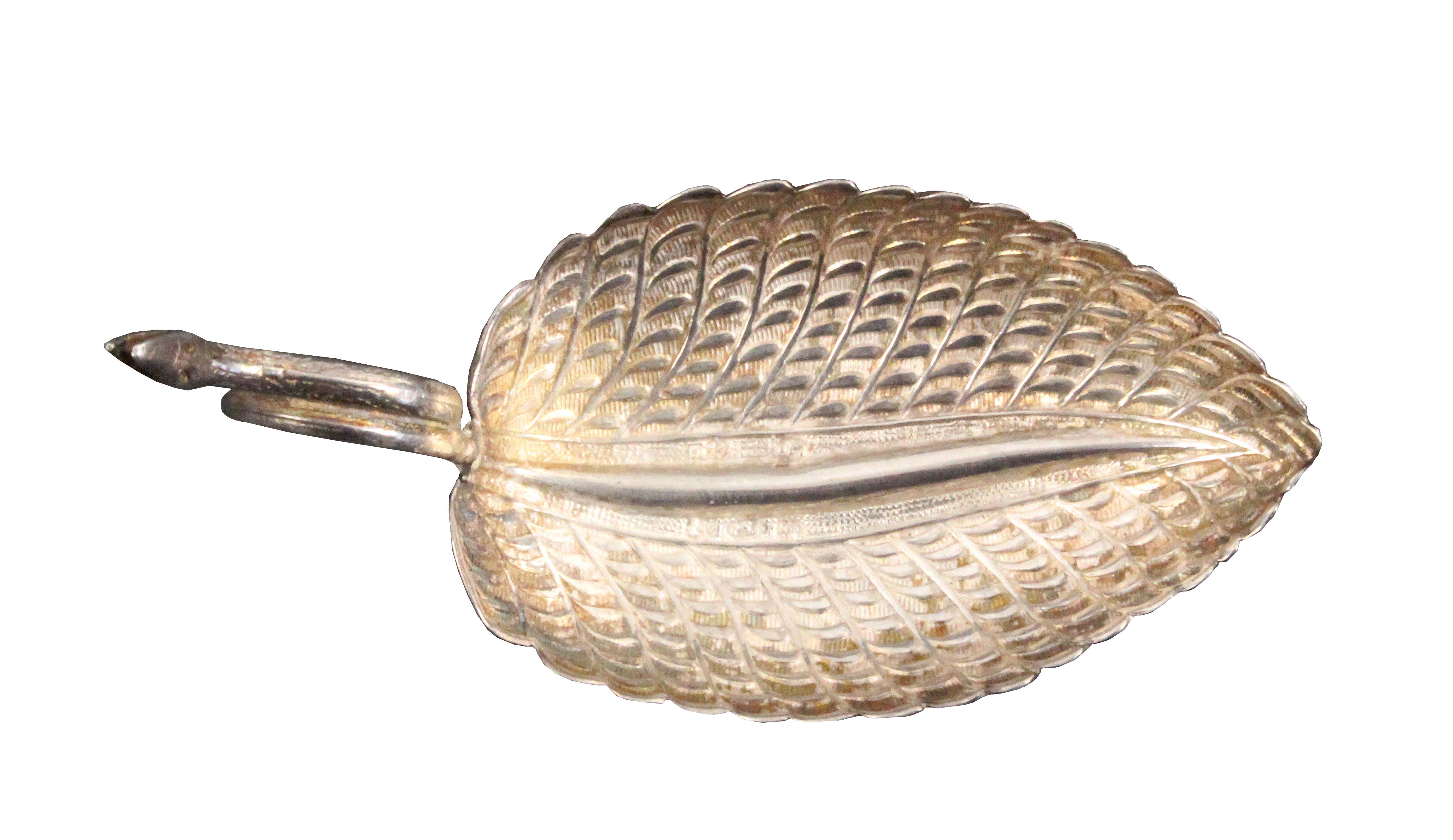 A silver caddy spoon, the leaf shaped and decorated bowl with the handle formed as an encircled - Image 2 of 2