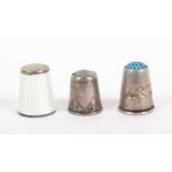 A Norwegian silver and enamel thimble by David Anderson, and two others, the first in white