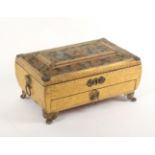 A rare painted velvet, gilt foil and brass mounted Regency sewing box of sarcophagal form, raised on