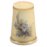 A Worcester blush ivory ground thimble, painted with forget-me-not between gilt lines, unmarked.