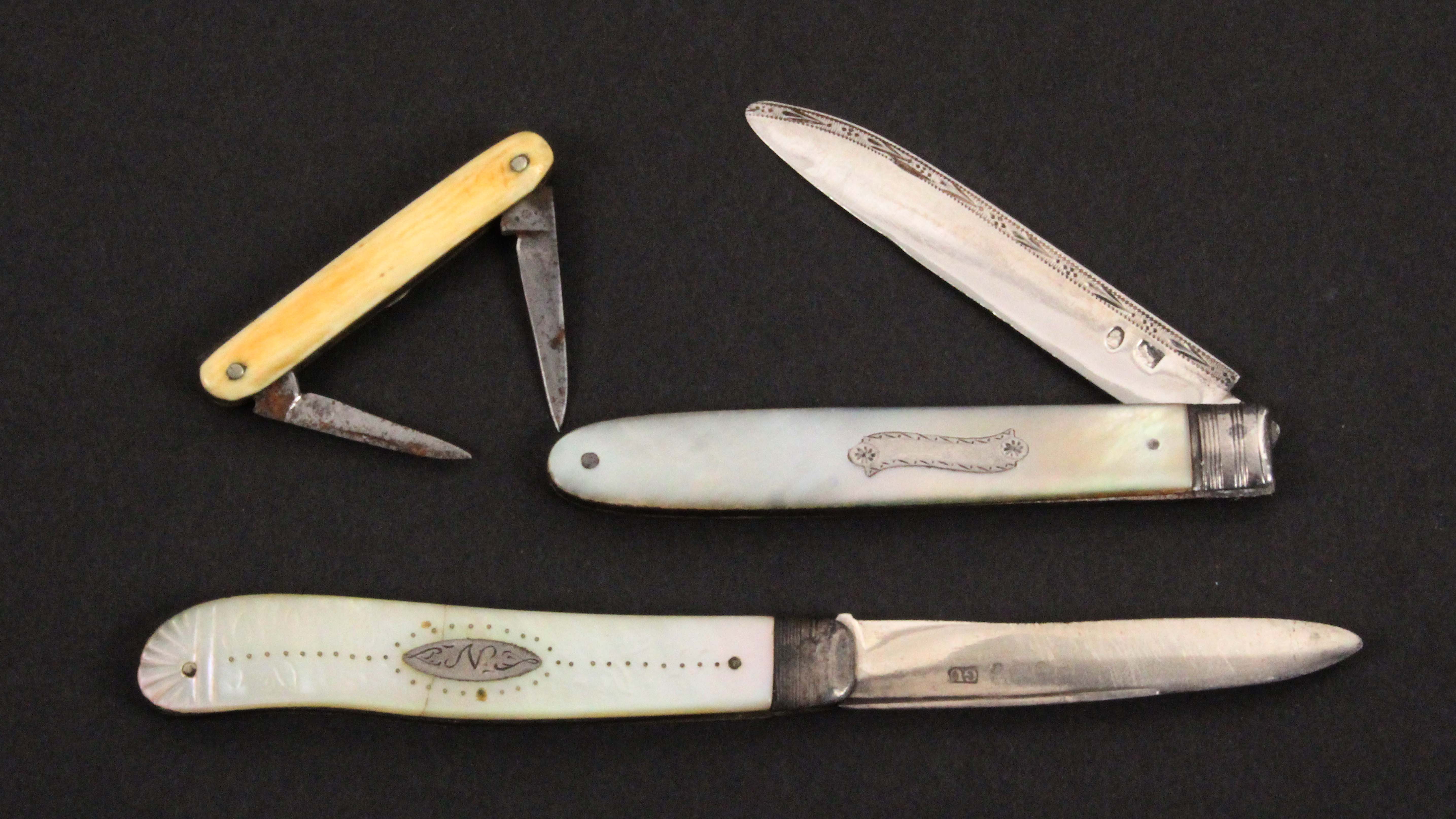 Two silver blade fruit knives and another pocket knife, the fruit knives with mother of pearl