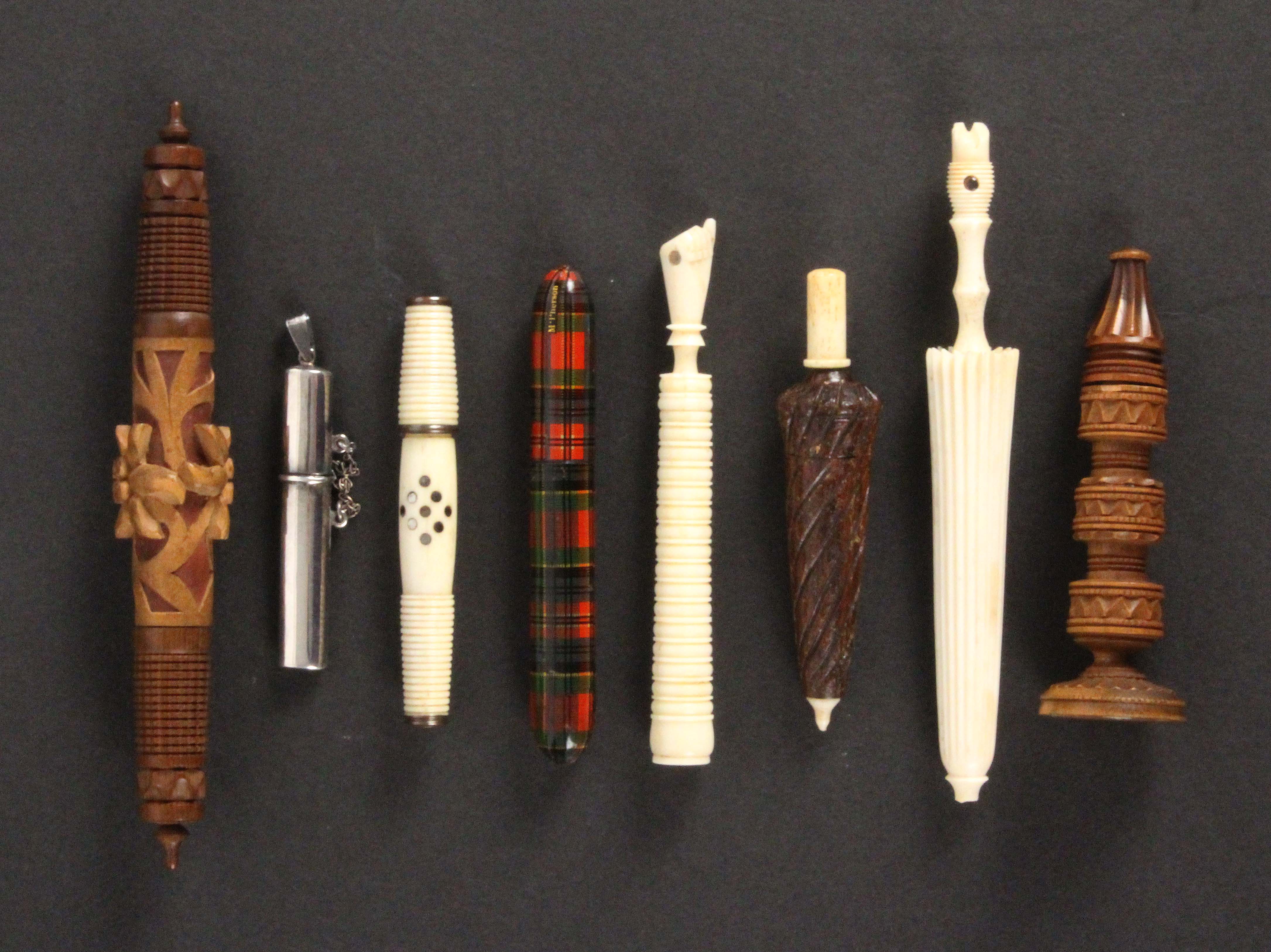 Eight needle cases, comprising a Tartan ware (M'Pherson) cylinder example, 9cms, a bone furled